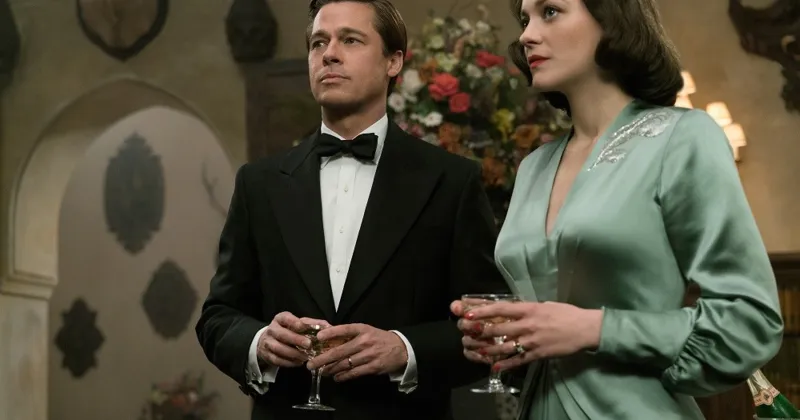 Brad Pitt và Marion trong trang phục sang trọng khi thực hi&ecirc;̣n nhi&ecirc;̣m vụ